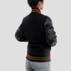 All Black Letterman Jacket With Faux Leather Sleeves And Orange Stripes